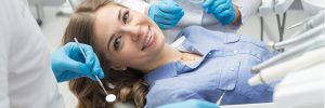 female-patient-at-the-dentist-in-lying-in-chair